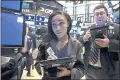  ?? RICHARD DREW – THE ASSOCIATED PRESS ?? Trader Lauren Simons works on the floor of the New York Stock Exchange Monday. Stocks are solidly higher on Wall Street after trade tensions between the U.S. and China dissipated.