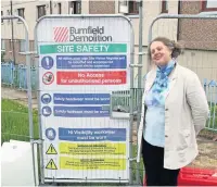  ??  ?? End of an era Janice Ross at the entrance to the demolition site