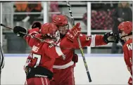  ?? AUSTIN HERTZOG — MEDIANEWS GROUP ?? Owen J. Roberts’ Sean Kavanagh, facing, celebrates with teammates after scoring the game-winning goal in the third period.