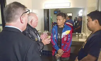  ??  ?? Referee Lou Moret gives reminders to Ancajas in locker room talk.