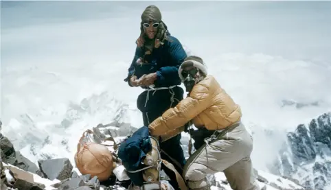  ??  ?? Sir Edmund Hillary and Tenzing Norgay climbing Mount Everest in 1953