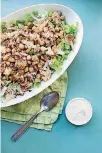  ?? [PHOTO BY LUCY BENI/AP] ?? Roasted cauliflowe­r and chickpea salad with garlic-tahini dressing is from a recipe by Katie Workman.