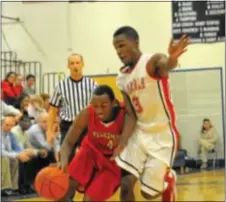  ?? Photo courtesy J.S. Garber ?? Neshaminy senior Marvin Carr (L) dribbles around a defender in recent Redskins’ duel with Plymouth Whitemarsh.