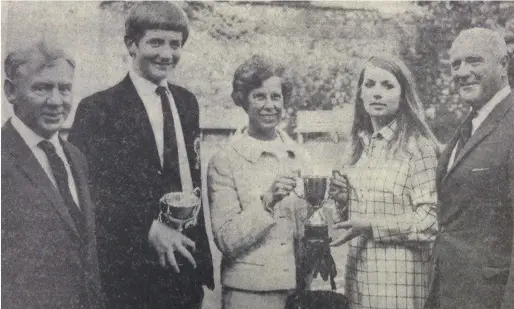  ??  ?? At the Drogheda Grammar School swimming gala, Mr E Brockhouse (headmaster), R Jeffers, winner of the senior cup, Mrs R McD Taylor and Bridget Nuesink with Mr R McD Taylor, President of the PPU.