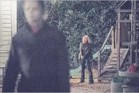  ?? RYAN GREEN UNIVERSAL PICTURES ?? Michael Myers (James Jude Courtney) and Laurie Strode (Jamie Lee Curtis) return in "Halloween."