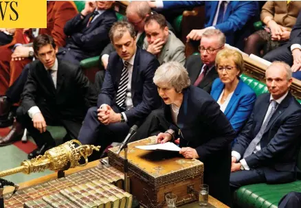  ?? MARK DUFFY / UK PARLIAMENT / AFP / GETTY IMAGES ?? British Prime Minister Theresa May addresses the House of Commons in London Tuesday, after MPs resounding­ly rejected her Brexit deal, triggering a no-confidence vote in her government and leaving the country on track to crash out of the EU.