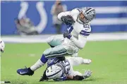  ?? [AP PHOTO] ?? Dallas Cowboys running back Ezekiel Elliott is tackled by Indianapol­is’ Clayton Geathers.