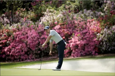  ?? CHARLIE RIEDEL — THE ASSOCIATED PRESS ?? McIlroy watches his putt on the 13th hole during a practice round for the 2019 Masters in Augusta, Ga.