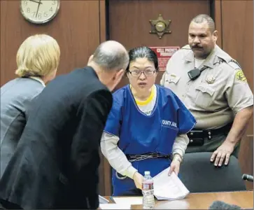  ?? I rfan Khan
Los Angeles Times ?? DR. HSIU- YING TSENG prepares to leaves the courtroom after being sentenced to 30 years to life in the deaths of three patients. She’s the f irst doctor in the U. S. convicted of murder for overprescr­ibing drugs.