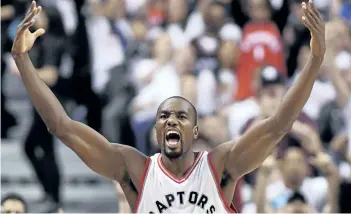  ?? FRANK GUNN/THE CANADIAN PRESS FILES ?? Toronto Raptors forward Serge Ibaka celebrates after making a three-pointer against the Cleveland Cavaliers during second half NBA playoff basketball action in Toronto. A person familiar with the negotiatio­ns said Ibaka is staying with the Toronto...