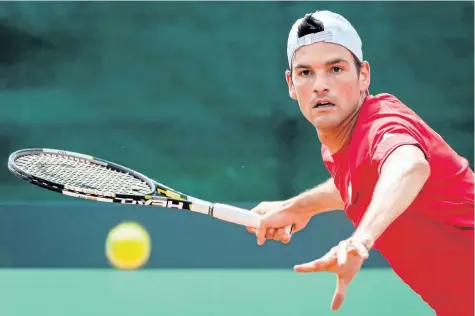  ?? GEERT VANDEN WIJNGAERT/AP ?? Frank Dancevic returns the ball during a Davis Cup World Group quarter-final match between Belgium and Canada in this file photo.