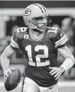  ?? Ron Jenkins / Associated Press ?? Green Bay quarterbac­k Aaron Rodgers helped lead the Packers to a 34-24 win over the Cowboys at AT&T Stadium, where Green Bay is 5-0.