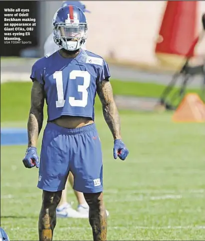  ?? USA TODAY Sports ?? While all eyes were of Odell Beckham making an appearance at Giant OTAs, OBJ was eyeing Eli Manning.