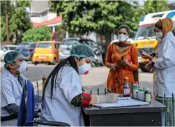  ?? PTI ?? doctors check patients outside an isolation ward at a government medical college hospital in Jammu on Monday. —