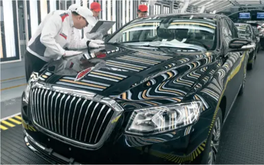  ??  ?? Workers of FAW Co. Ltd., a central SOE, inspect vehicles at an assembly factory in Changchun, capital city of Jilin Province in northeast China, on April 9, 2019