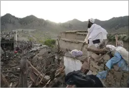  ?? EBRAHIM NOOROOZI — THE ASSOCIATED PRESS ?? A man stands among destructio­n after an earthquake in Gayan village in the Paktika province of Afghanista­n on Thursday.