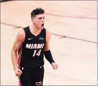  ?? Mark J. Terrill / Associated Press ?? Miami Heat guard Tyler Herro celebrates a basket against the Boston Celtics late in the second half of Game 4 of the Eastern Conference final on Wednesday in Lake Buena Vista, Fla.