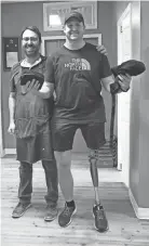  ?? CLARION LEDGER SPECIAL TO ?? Pictured with prosthetis­t David Rotter, Matt Branch, of Monroe, La., is now walking with a prosthetic and hunting again after his leg was amputated due to being shot by a dog.