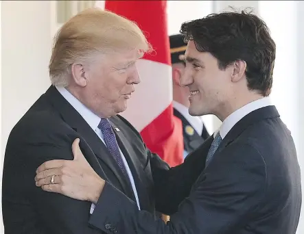  ?? MANDEL NGANMANDEL NGAN/AFP/GETTY IMAGES ?? U.S. President Donald Trump greets Prime Minister Justin Trudeau for the first time at the White House in Washington, D.C. on Monday.