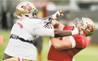  ?? Noah Berger / Special to The Chronicle ?? 49ers defensive tackle Quinton Dial (left) and offensive lineman Tim Barnes engage in drills in Santa Clara. Dial started 11 games last year; Barnes spent the past five seasons with the Rams.