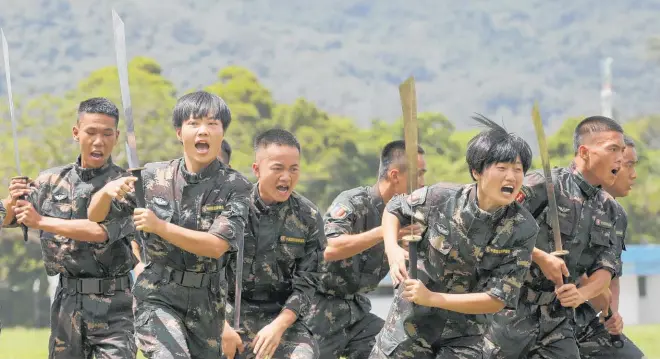  ?? Photo / AP ?? Soldiers go through a drill at a People’s Liberation Army base in Hong Kong.