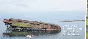  ??  ?? Dive in: A half submerged wreck in Scapa Flow, Orkney Islands