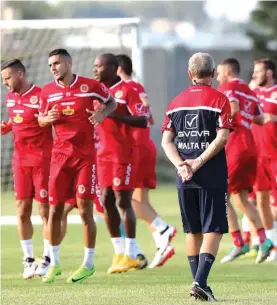  ?? Photo: Domenic Aquilina ?? Malta national coach Pietro Ghedin (back to camera) oversees some of his players during yesterday’s training session at Ta’ Qali