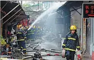  ?? XINHUA ?? Firefighte­rs put out the blaze at a restaurant in Wuhu in East China’s Anhui province on Saturday. The fire killed 17 people, among which 14 were students aged 15 to 20.