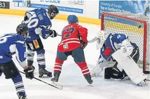  ??  ?? Comets Billy Baxter (red) scores against Kilmarnock Storm.