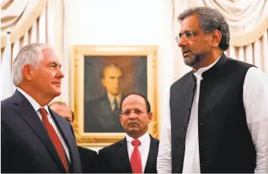  ?? Alex Brandon / AFP / Getty Images ?? Premier Shahid Khan Abbasi (right) told Rex Tillerson that he is “committed in the war against terror.”