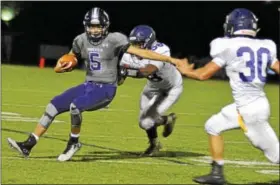  ?? BARRY TAGLIEBER — FOR DIGITAL FIRST MEDIA ?? Phoenixvil­le’s Connor Patania looks to go around Upper Moreland’s Rodney Gowans and Billy McKenna.