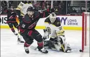  ?? Karl B DeBlaker Associated Press ?? CAROLINA’S Vincent Trocheck is happy to see Sebastian Aho’s goal go in against Linus Ullmark.