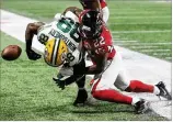  ?? CURTIS COMPTON / CCOMPTON@AJC.COM ?? Falcons safety Keanu Neal puts a hit on Packers running back Ty Montgomery during a win earlier this season.