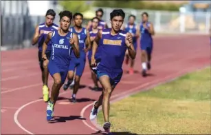 ?? VINCENT OSUNA PHOTO ?? Southwest High’s Nathan Garcia (right) and Central Union High’s Luis Sandoval (left) work to take the lead in the boys’ 800-meter run during their Imperial Valley League track and field meet on Thursday in El Centro. Sandoval won both the 800-meter and...