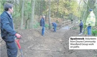  ??  ?? Spadework Volunteers from Doune Community Woodland Group work on paths