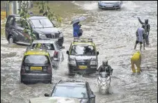  ?? PTI ?? Vehicles ply during rain in Mumbai on Wednesday.