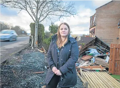  ?? Picture: Kenny Smith. ?? Jackie Black stands by her destroyed fence after the accident.