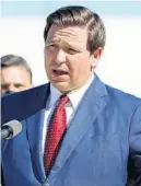  ?? AMY BETH BENNETT/ SOUTH FLORIDA SUN SENTINEL ?? Gov. Ron DeSantis announces the conversion of part of the Hard Rock Stadium COVID-19 test site to a COVID-19 vaccinatio­n site Jan. 6 in Miami Gardens.