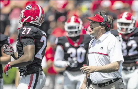  ?? DAVID BARNES / DAVID.BARNES@AJC.COM ?? Georgia coach Kirby Smart has increased the number of people on the support staff since he took over from Mark Richt. The support staff is prohibited from coaching on the field and recruiting.