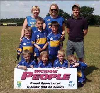  ??  ?? The Carnew Emmets under-7 footballer­s with their amazing mentors at the Coolkenno GAA Club Go Games blitz last weekend.