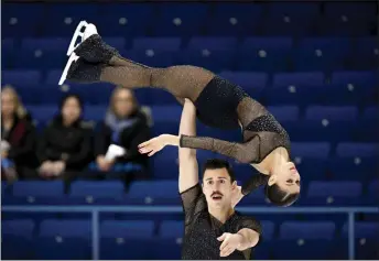  ?? ?? Ambrosini lifting Ghilardi during the duo’s routine at the Espoo Figure Skating Grand Prix in Finland. — AFP photo