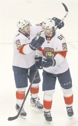  ??  ?? Panthers defenceman Keith Yandle, left, and right wing Jaromir Jagr celebrate.