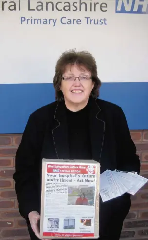  ?? Rosie Cooper MP with petition-reply slips outside West Lancashire Clinical Commission­ing Group office in Ormskirk ??