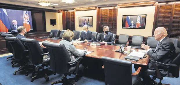  ?? ?? U.S. President Joe Biden (R) holds virtual talks with Russian President Vladimir Putin (on screen) amid Western fears that Moscow plans to attack Ukraine, at the White House, Washington, D.C., U.S., Dec. 7, 2021.