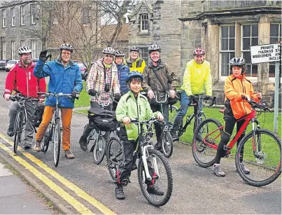  ??  ?? Members of St Andrews Space for Cycling are highlighti­ng the dangers for cyclists in the town, below.