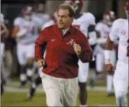  ?? ROGELIO V. SOLIS —ASSOCIATED PRESS ?? In this Nov. 11 photo, Alabama head coach Nick Saban leads his team to the field for warmups against Mississipp­i State in Starkville, Miss.