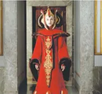  ??  ?? Queen Amidala (Natalie Portman) wears the Throne Room
Gown in “Star Wars: Episode I — The Phantom
Menace.”
