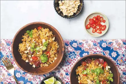  ?? PHOTOS BY KARSTEN MORAN / THE NEW YORK TIMES ?? A Thai-style rice salad served with peanuts, chiles and lime makes for an exotic dish, and it’s a great way to use leftover rice.