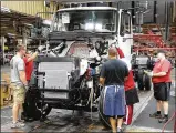  ?? BILL LACKEY / STAFF ?? Workers at Navistar’s Springfiel­d plant assemble a truck cab in 2017. The company reported a net loss of $81 million during the first quarter.
