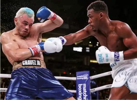  ?? Photo: ED MULHOLLAND/MATCHROOM ?? ENOUGH IS ENOUGH: Jacobs halts Chavez with the minimum of fuss